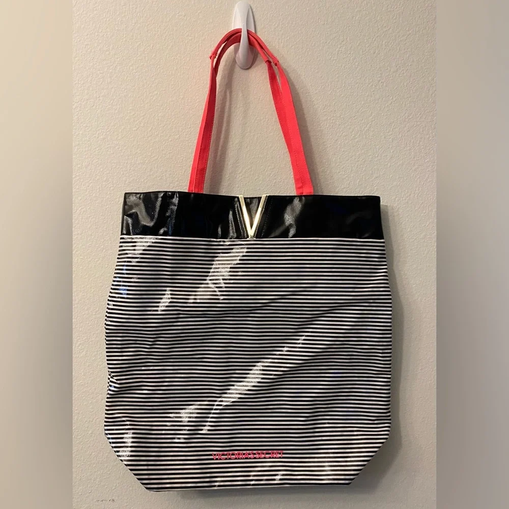 Victoria’s Secret plastic tote bag. Black and white stripe. Canvas pink handles